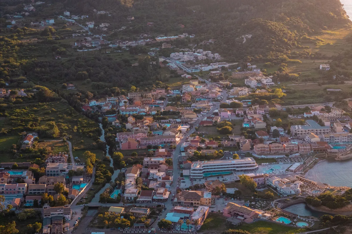 Aerial view of Agios Georgios bay in north-west Corfu at sunset