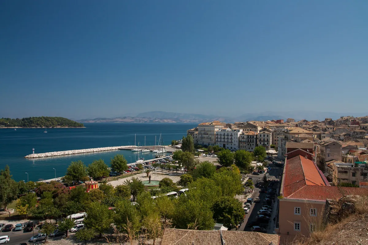 View over Corfu Town's rooftops and harbour towards the Greek mainland