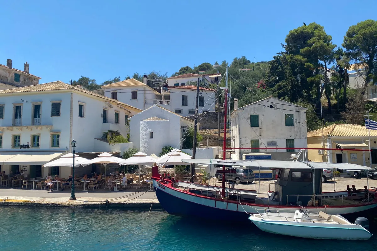 Boats and traditional buildings along Gaios harbour on Paxos