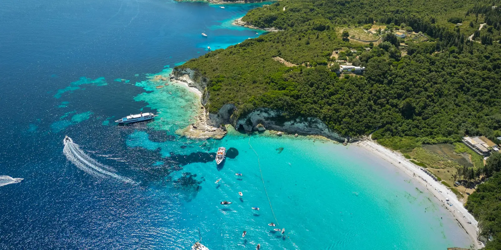 Aerial view of a beach with turquoise water on Paxos