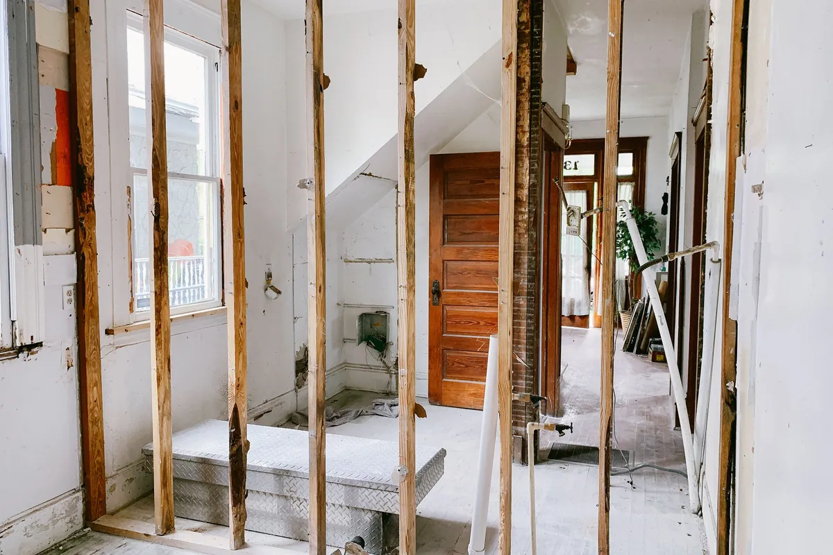 Interior of a house under renovation with exposed wooden beams